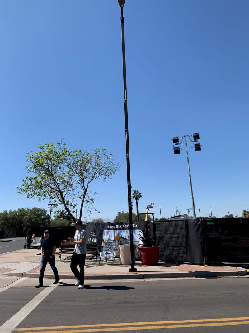 The corner of 83rd Avenue and Jefferson Street fenced for construction with the Jefferson House Coming 2026 banner