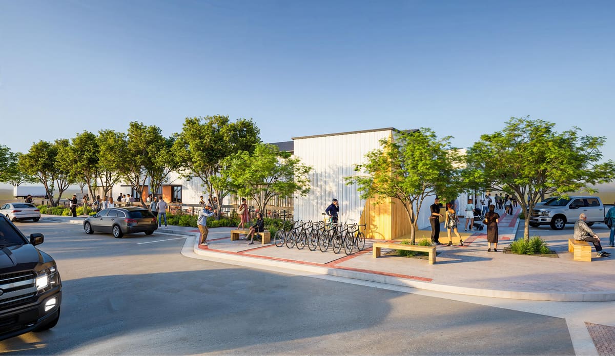 Southeast corner of Jefferson House with bike racks, benches and shade trees